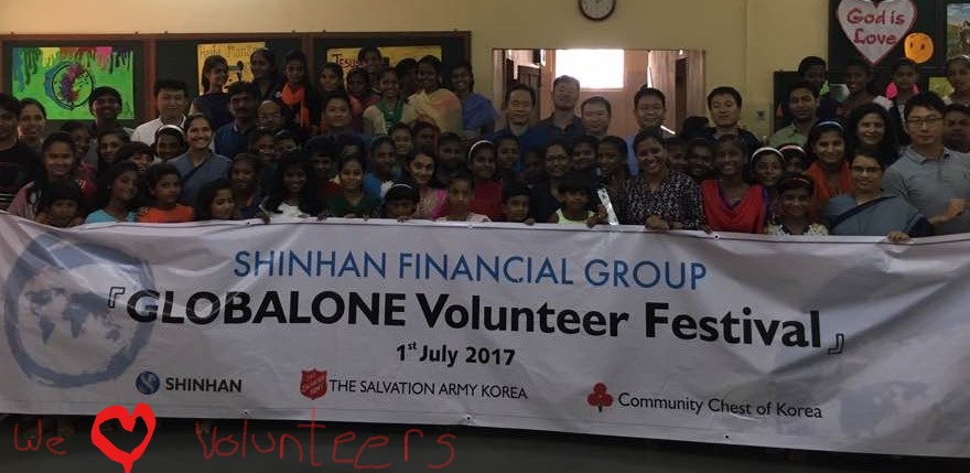 happy children with happy volunteers and benefactors from Shinhan Bank